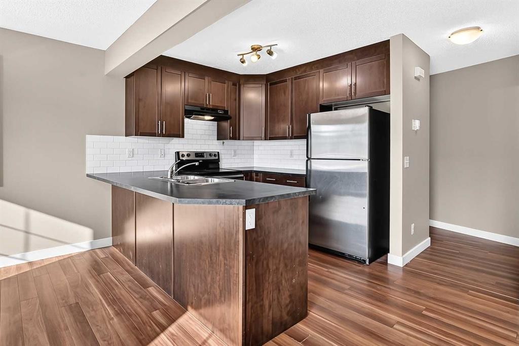 141 Pantego Lane Nw, Calgary, AB - Indoor Photo Showing Kitchen With Double Sink