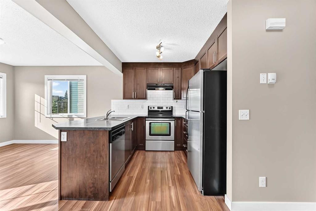 141 Pantego Lane Nw, Calgary, AB - Indoor Photo Showing Kitchen With Stainless Steel Kitchen With Double Sink