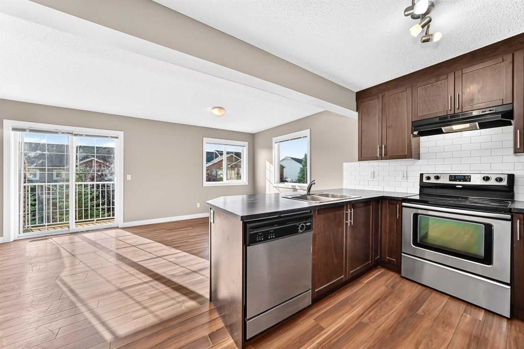 141 Pantego Lane Nw, Calgary, AB - Indoor Photo Showing Kitchen With Stainless Steel Kitchen With Double Sink