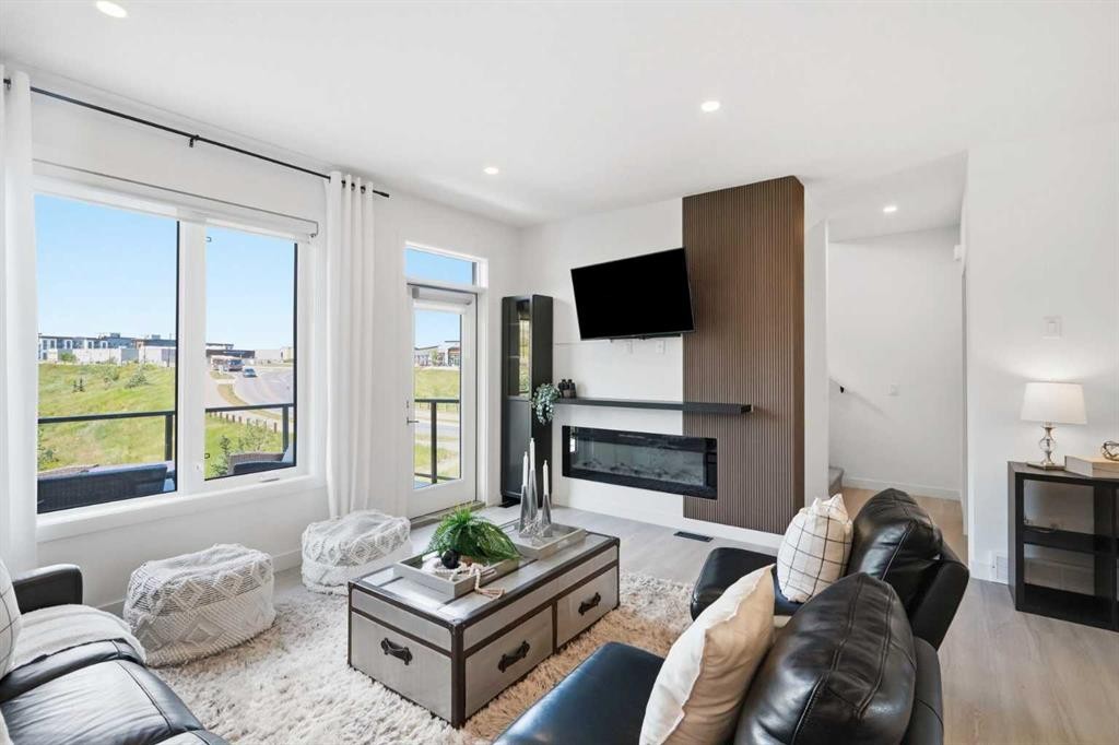 108 Na'A Heights Sw, Calgary, AB - Indoor Photo Showing Living Room With Fireplace