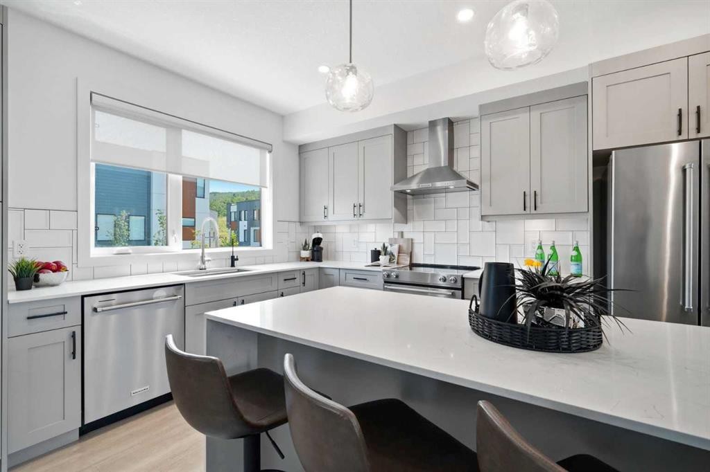 108 Na'A Heights Sw, Calgary, AB - Indoor Photo Showing Kitchen With Stainless Steel Kitchen With Upgraded Kitchen