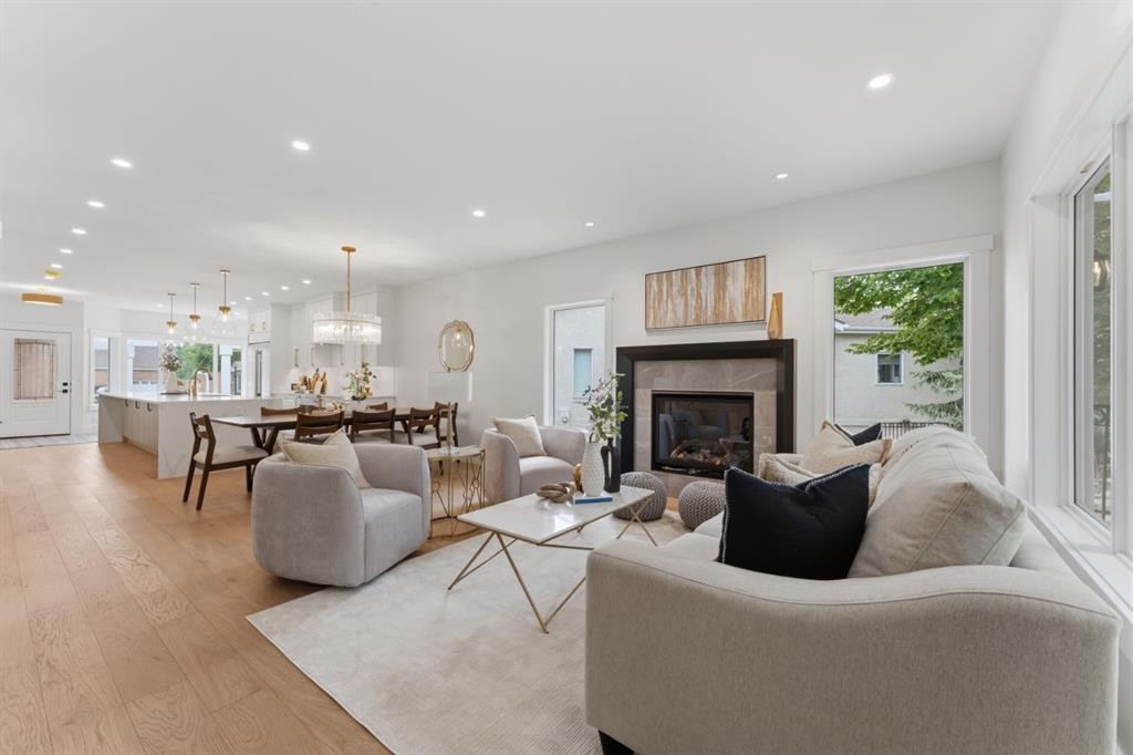 12 Prominence Point Sw, Calgary, AB - Indoor Photo Showing Living Room With Fireplace
