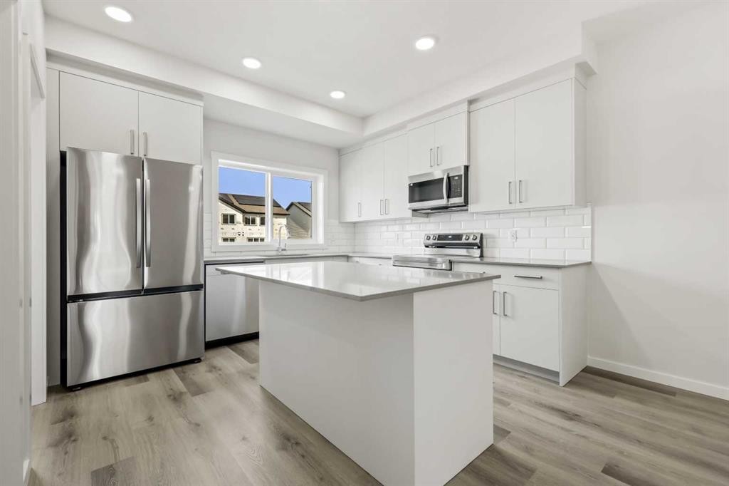 36 Heartwood Lane Se, Calgary, AB - Indoor Photo Showing Kitchen With Upgraded Kitchen