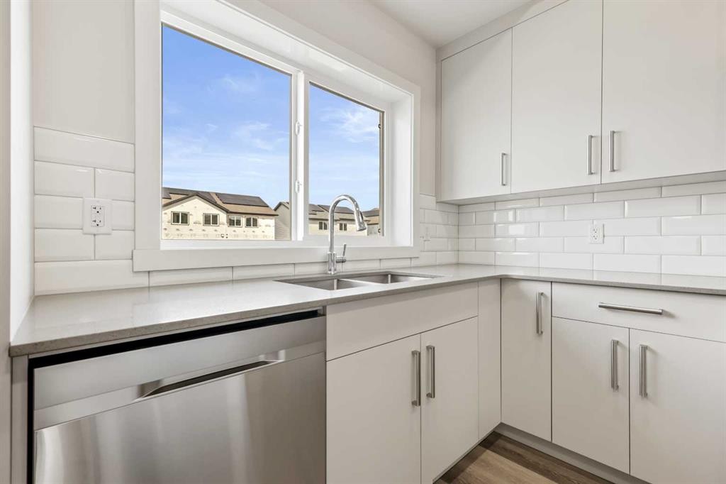 36 Heartwood Lane Se, Calgary, AB - Indoor Photo Showing Kitchen With Double Sink