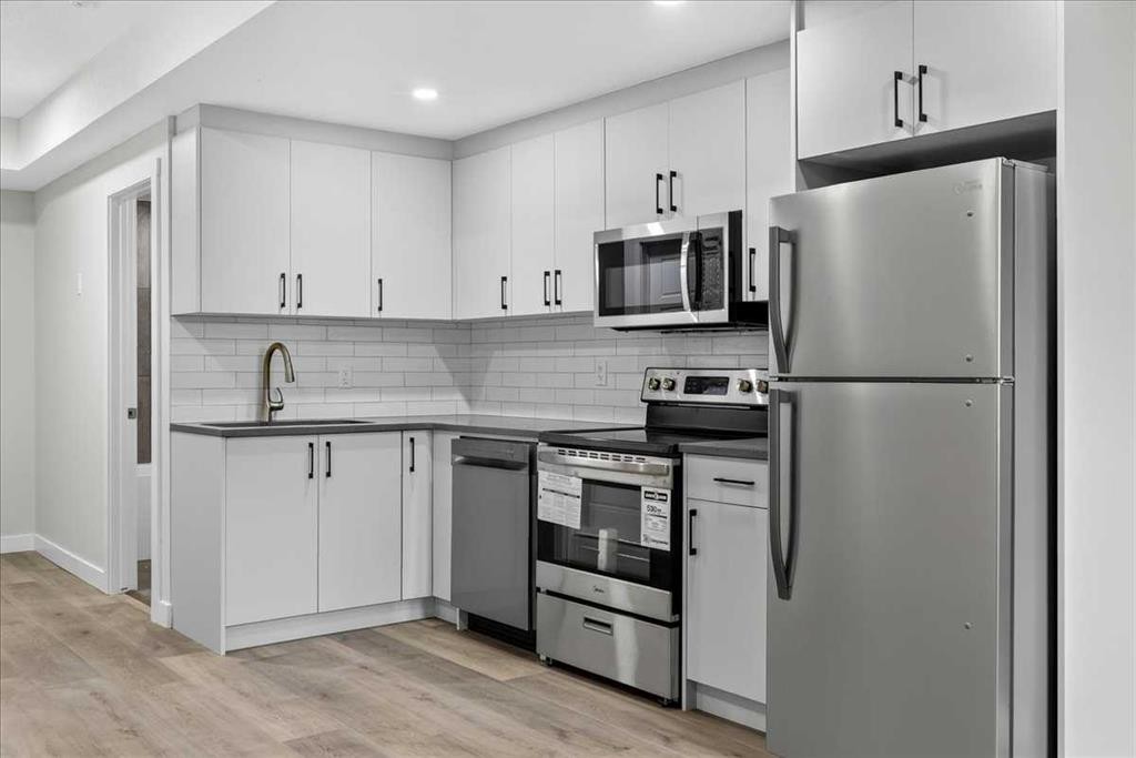 36 Heartwood Lane Se, Calgary, AB - Indoor Photo Showing Kitchen With Upgraded Kitchen