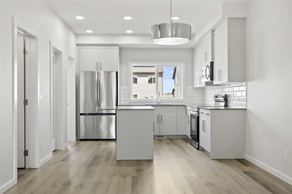 36 Heartwood Lane Se, Calgary, AB - Indoor Photo Showing Kitchen With Upgraded Kitchen