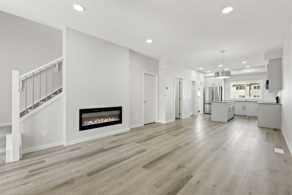 36 Heartwood Lane Se, Calgary, AB - Indoor Photo Showing Living Room With Fireplace