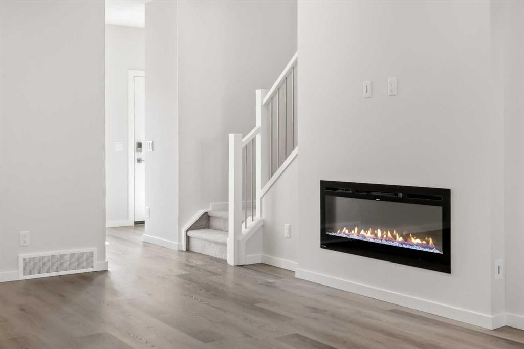 36 Heartwood Lane Se, Calgary, AB - Indoor Photo Showing Living Room With Fireplace