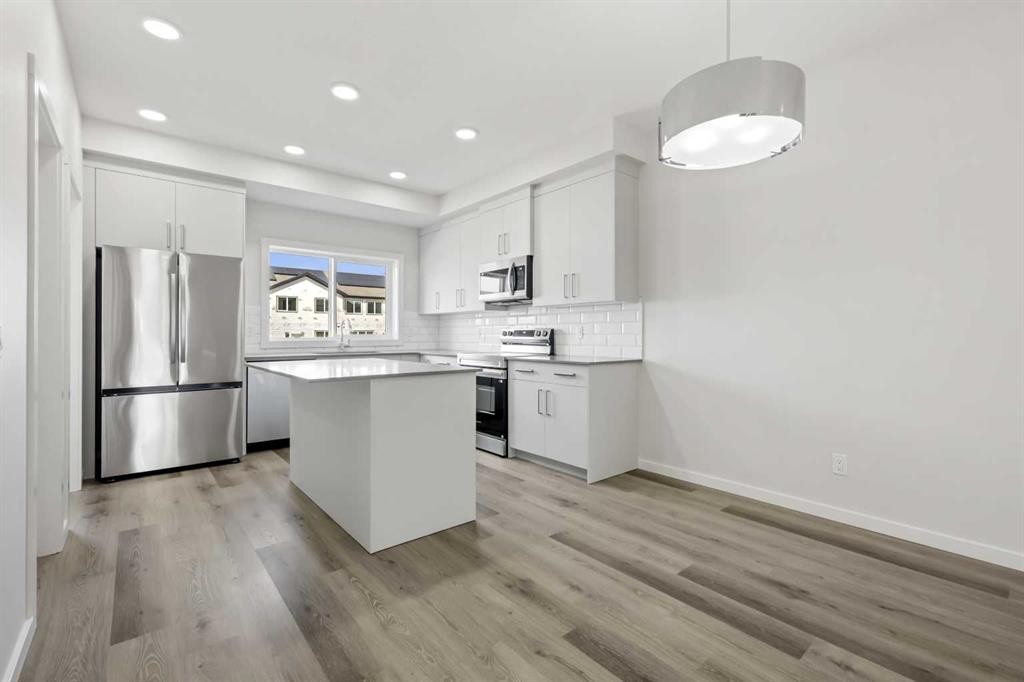 36 Heartwood Lane Se, Calgary, AB - Indoor Photo Showing Kitchen With Upgraded Kitchen