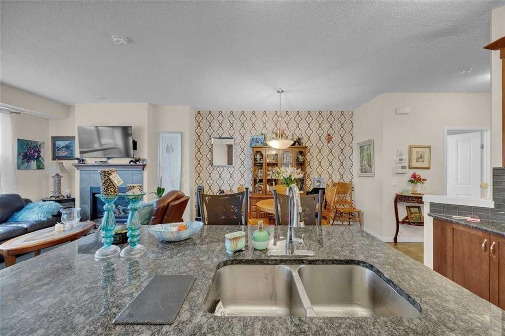 226 Sunset Point, Cochrane, AB - Indoor Photo Showing Kitchen With Double Sink