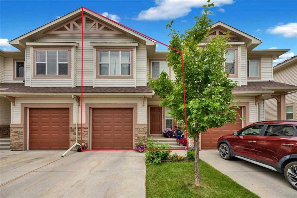 226 Sunset Point, Cochrane, AB - Outdoor With Facade