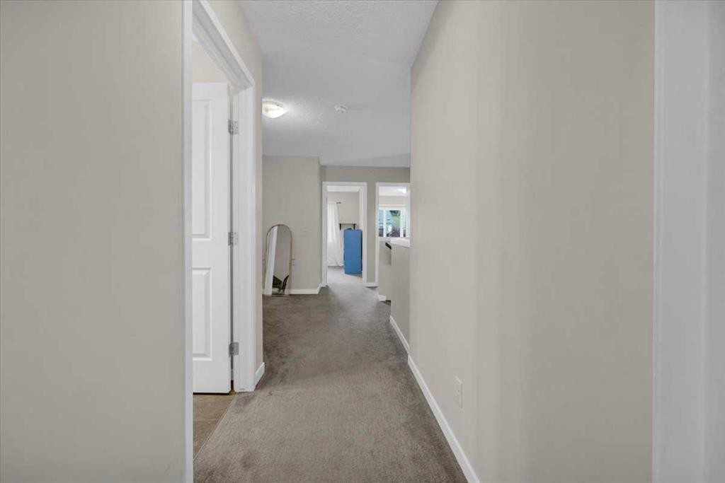 226 Sunset Point, Cochrane, AB - Indoor Photo Showing Other Room