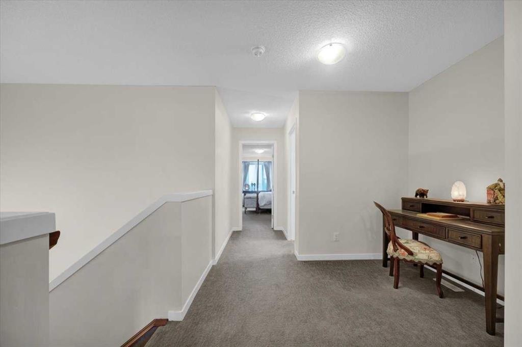 226 Sunset Point, Cochrane, AB - Indoor Photo Showing Other Room