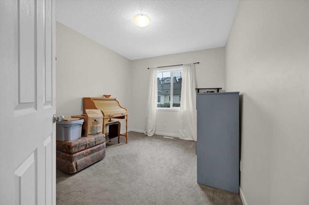 226 Sunset Point, Cochrane, AB - Indoor Photo Showing Other Room