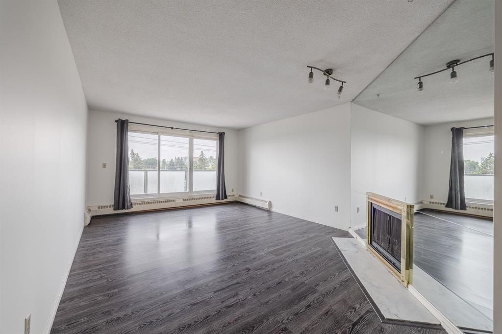 417-333 Garry Crescent Ne, Calgary, AB - Indoor With Fireplace