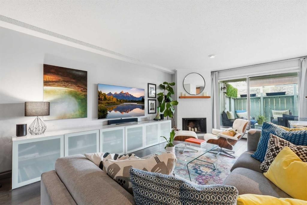214-10120 Brookpark Boulevard Sw, Calgary, AB - Indoor Photo Showing Living Room With Fireplace