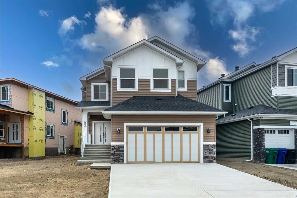 500 Rivercrest View, Cochrane, AB - Outdoor With Facade