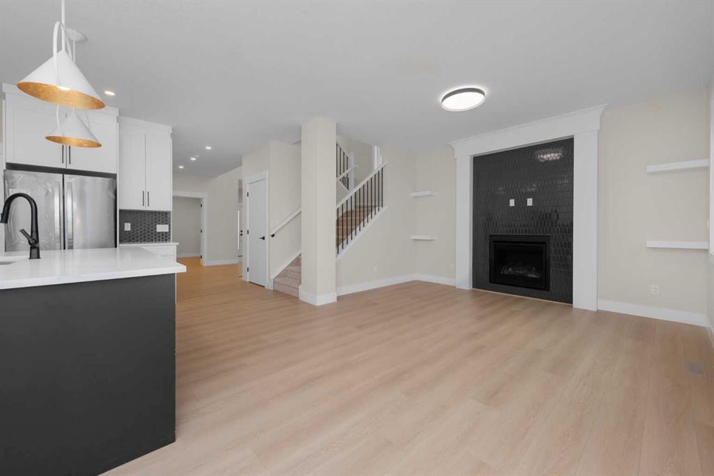 500 Rivercrest View, Cochrane, AB - Indoor With Fireplace