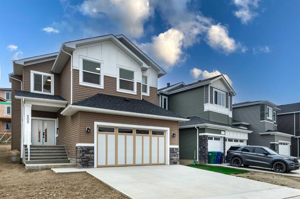 500 Rivercrest View, Cochrane, AB - Outdoor With Facade