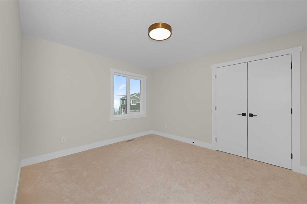 500 Rivercrest View, Cochrane, AB - Indoor Photo Showing Other Room