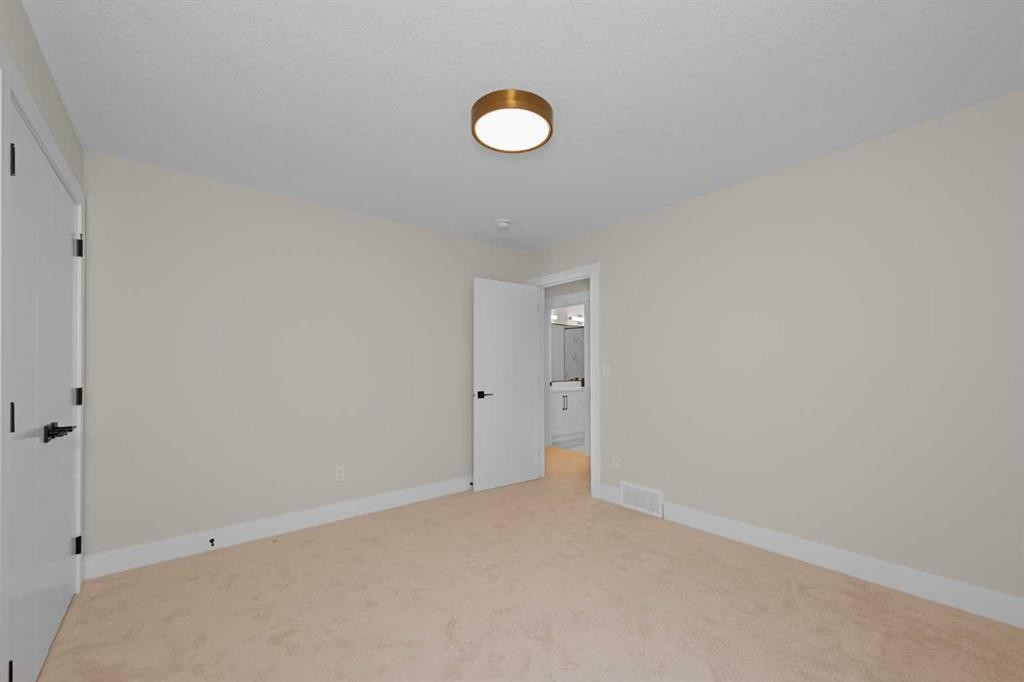 500 Rivercrest View, Cochrane, AB - Indoor Photo Showing Other Room