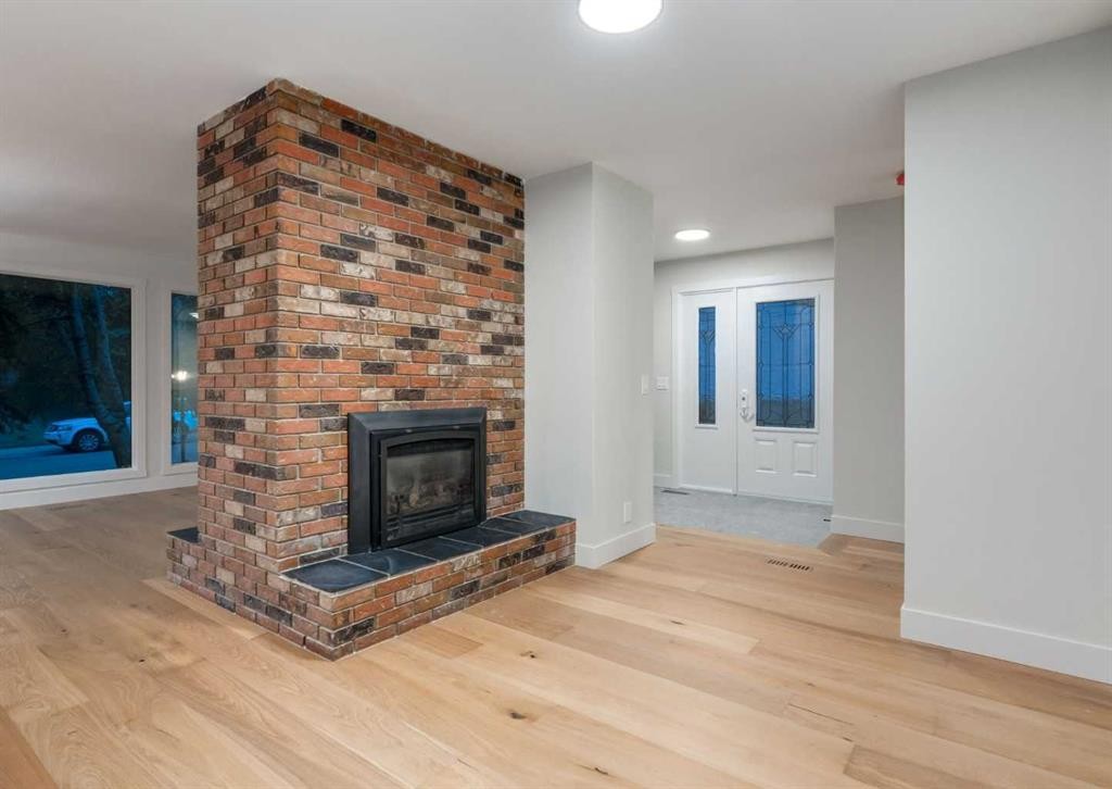 6460 Silver Ridge Way Nw, Calgary, AB - Indoor Photo Showing Living Room With Fireplace
