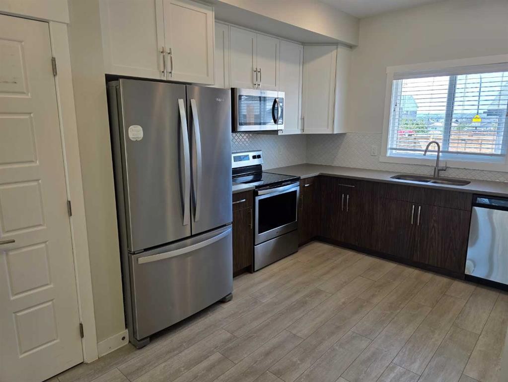 107 Lucas Boulevard Nw, Calgary, AB - Indoor Photo Showing Kitchen With Stainless Steel Kitchen With Double Sink
