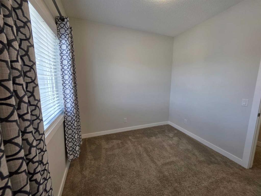 107 Lucas Boulevard Nw, Calgary, AB - Indoor Photo Showing Other Room
