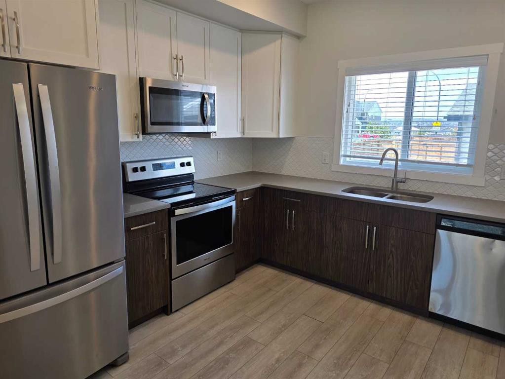 107 Lucas Boulevard Nw, Calgary, AB - Indoor Photo Showing Kitchen With Stainless Steel Kitchen With Double Sink