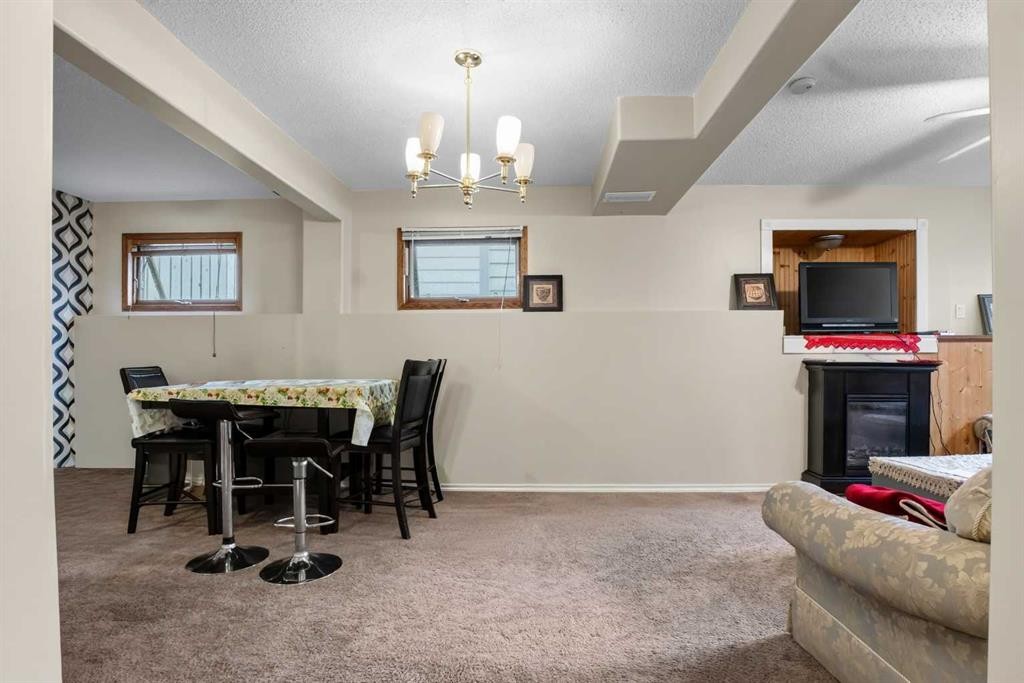 403 Shawinigan Drive Sw, Calgary, AB - Indoor With Fireplace