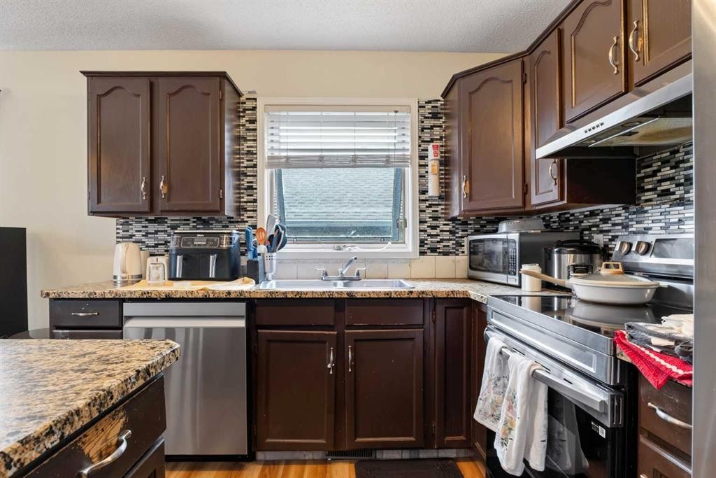 403 Shawinigan Drive Sw, Calgary, AB - Indoor Photo Showing Kitchen With Double Sink