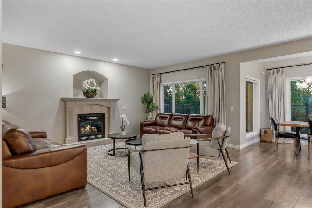 112 Pinto Lane Se, Airdrie, AB - Indoor Photo Showing Living Room With Fireplace