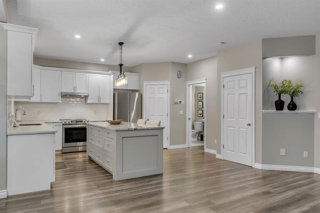 112 Pinto Lane Se, Airdrie, AB - Indoor Photo Showing Kitchen With Stainless Steel Kitchen With Upgraded Kitchen