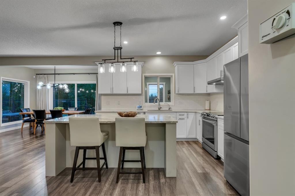 112 Pinto Lane Se, Airdrie, AB - Indoor Photo Showing Kitchen With Stainless Steel Kitchen With Upgraded Kitchen