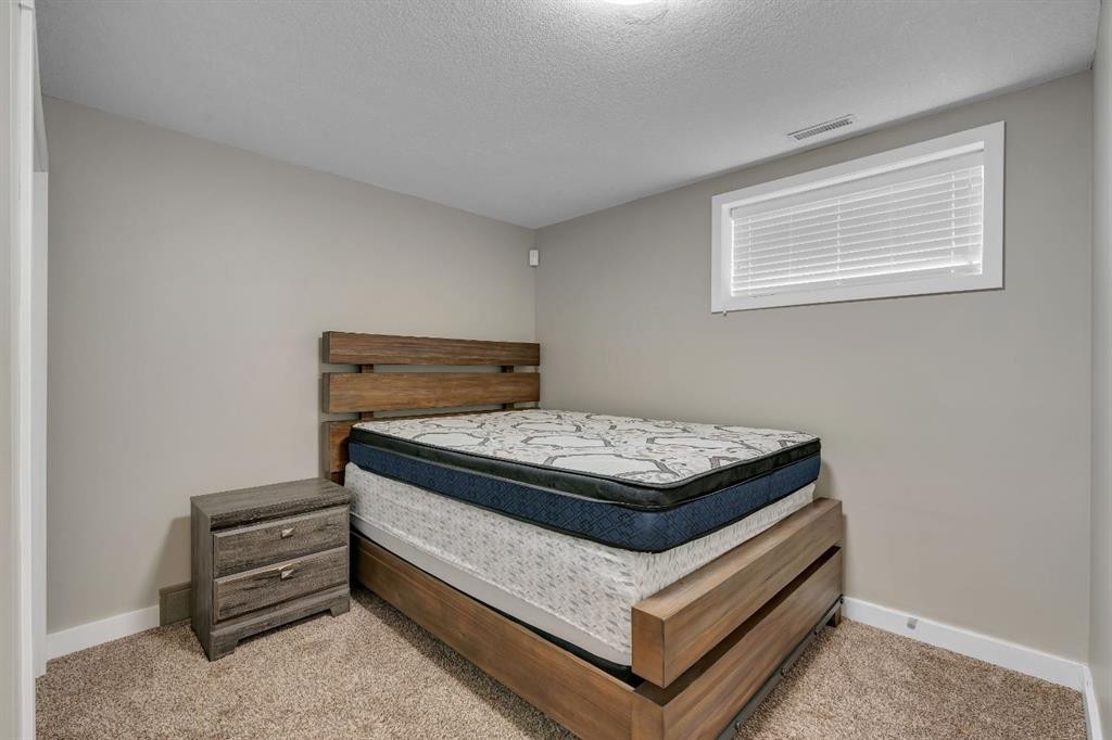 112 Pinto Lane Se, Airdrie, AB - Indoor Photo Showing Bedroom
