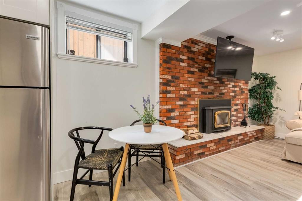131 Thorncrest Road Nw, Calgary, AB - Indoor Photo Showing Living Room With Fireplace