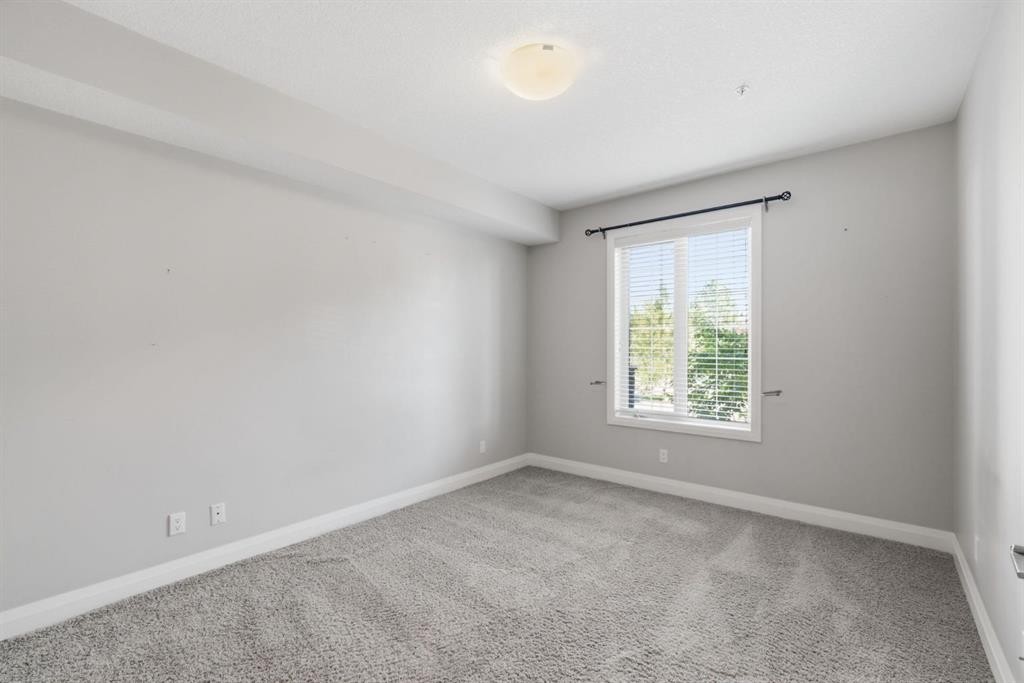 2208-15 Sunset Square, Cochrane, AB - Indoor Photo Showing Other Room