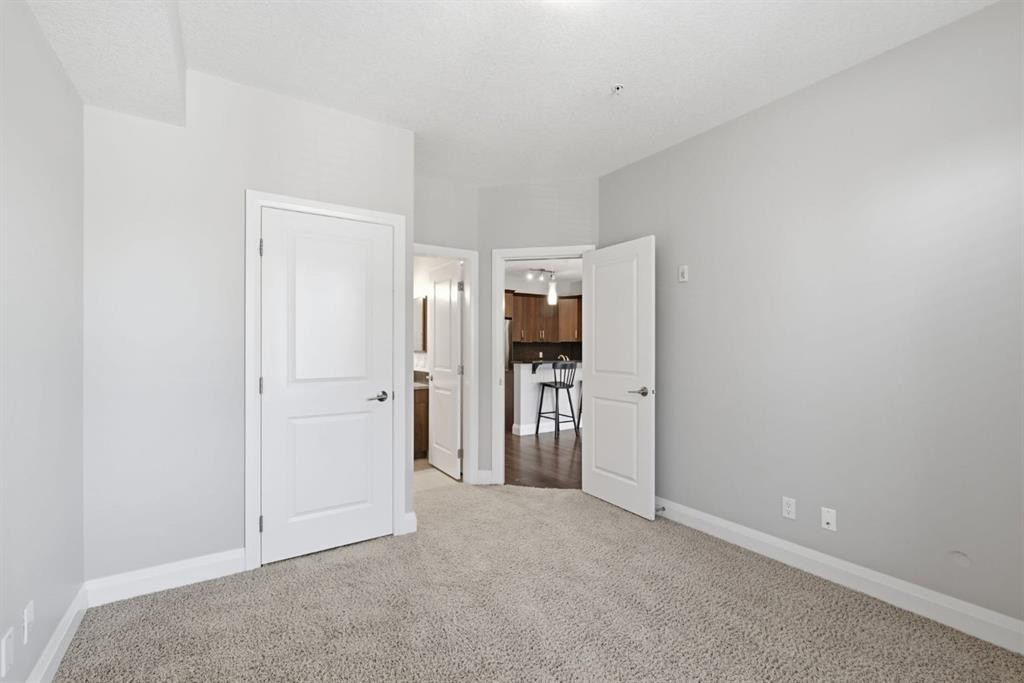 2208-15 Sunset Square, Cochrane, AB - Indoor Photo Showing Other Room