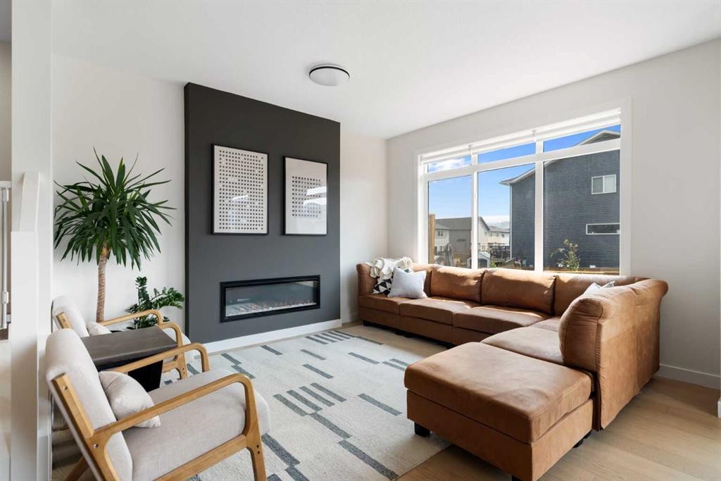 4 Mill Road, Cochrane, AB - Indoor Photo Showing Living Room With Fireplace