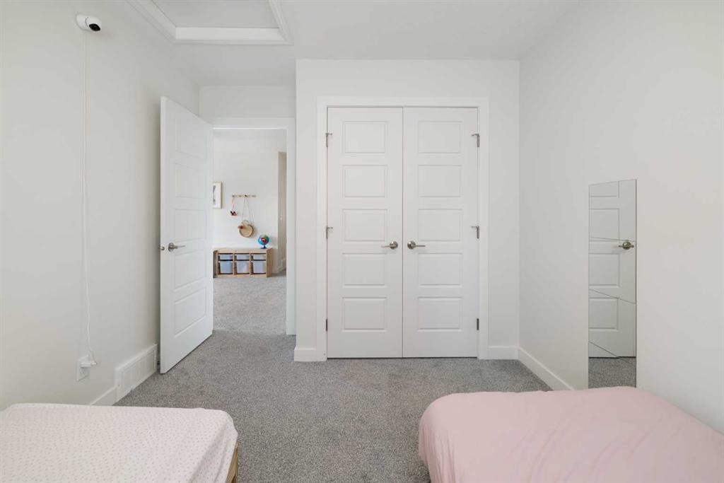4 Mill Road, Cochrane, AB - Indoor Photo Showing Bedroom