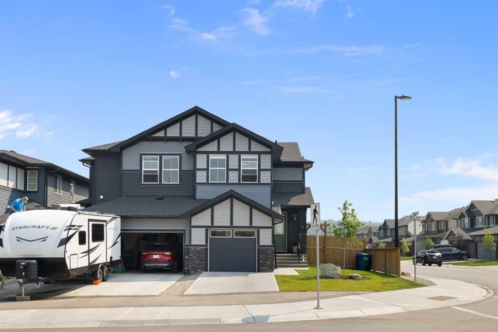 4 Mill Road, Cochrane, AB - Outdoor With Facade