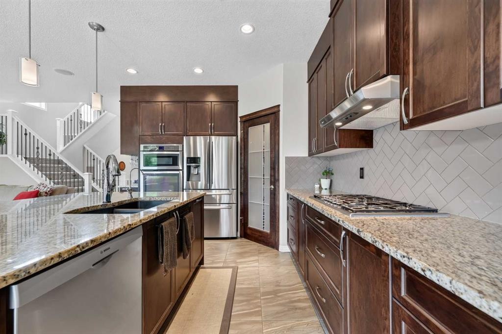 131 Cranarch Crescent Se, Calgary, AB - Indoor Photo Showing Kitchen With Stainless Steel Kitchen With Double Sink With Upgraded Kitchen
