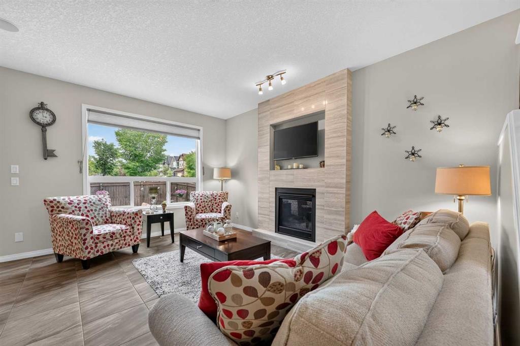 131 Cranarch Crescent Se, Calgary, AB - Indoor Photo Showing Living Room With Fireplace