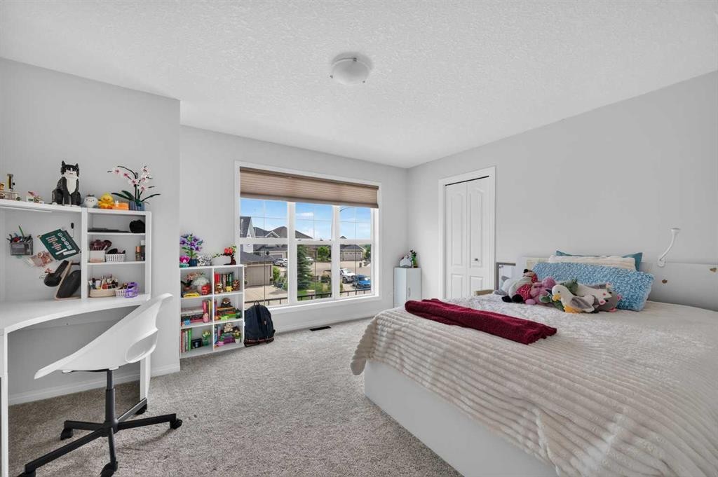 131 Cranarch Crescent Se, Calgary, AB - Indoor Photo Showing Bedroom