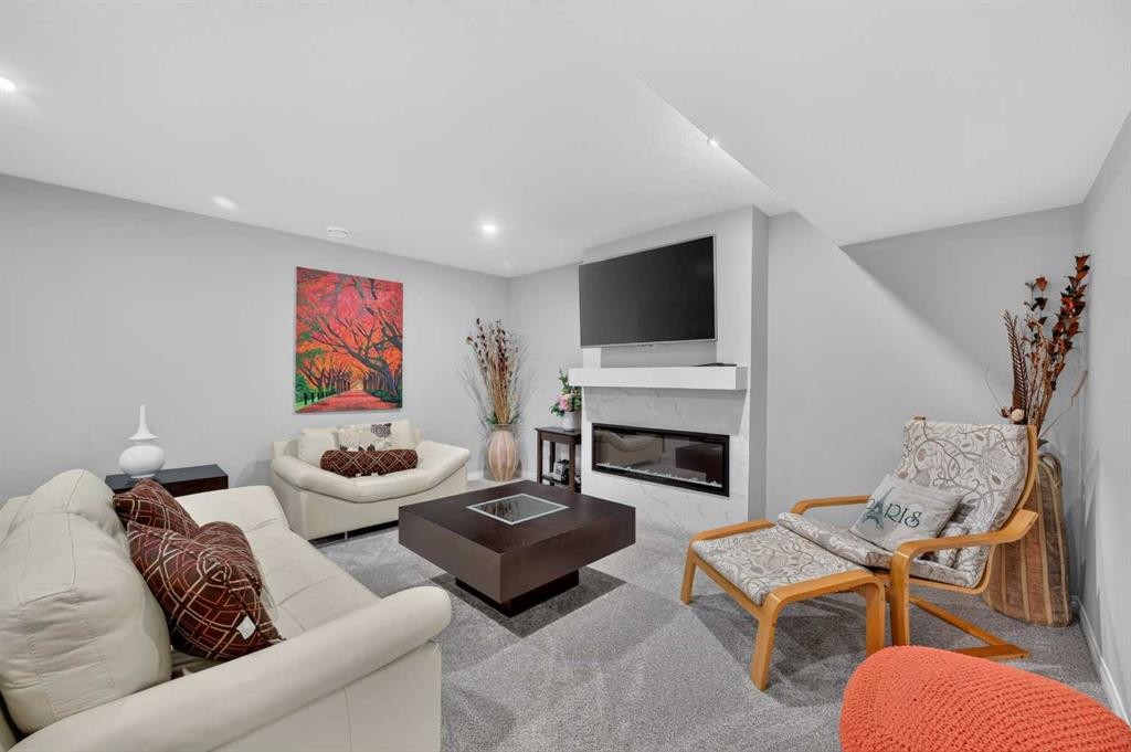 131 Cranarch Crescent Se, Calgary, AB - Indoor Photo Showing Living Room With Fireplace