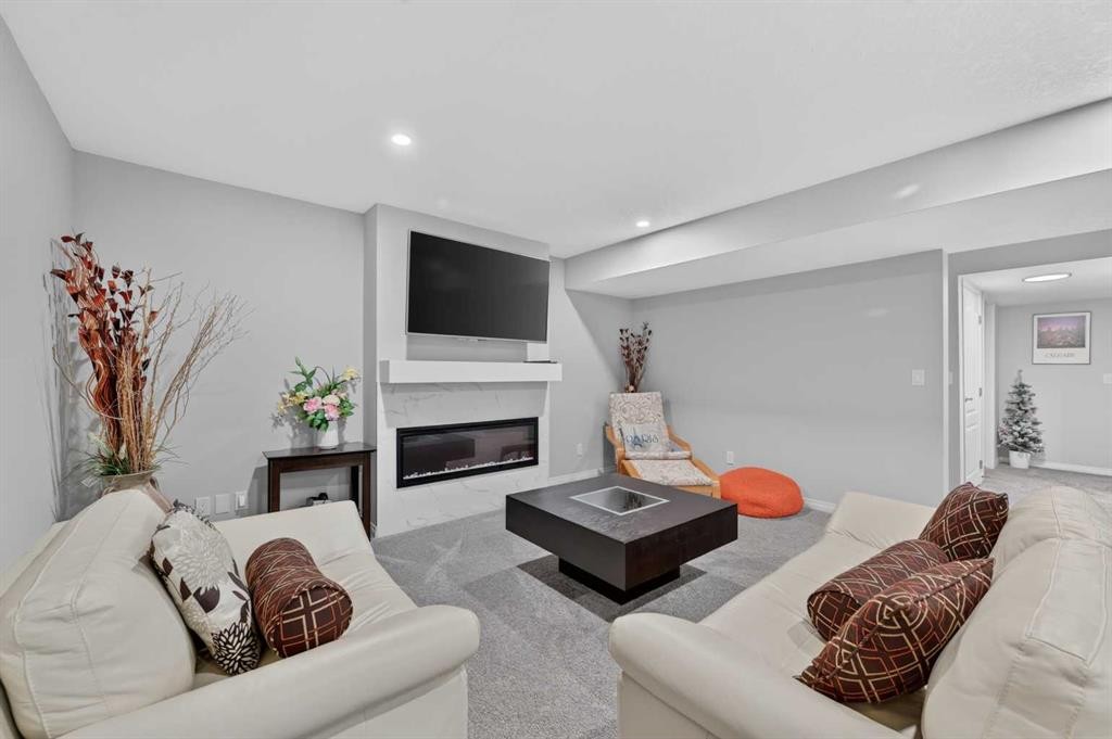 131 Cranarch Crescent Se, Calgary, AB - Indoor Photo Showing Living Room With Fireplace