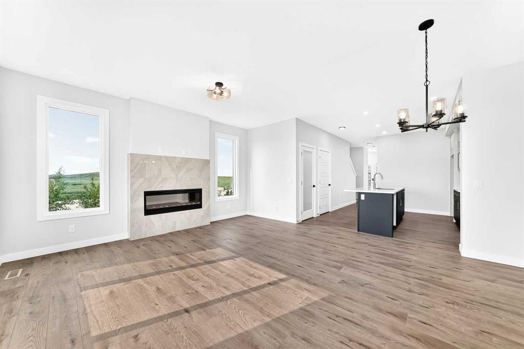 186 Lanark Gate Se, Airdrie, AB - Indoor Photo Showing Living Room With Fireplace