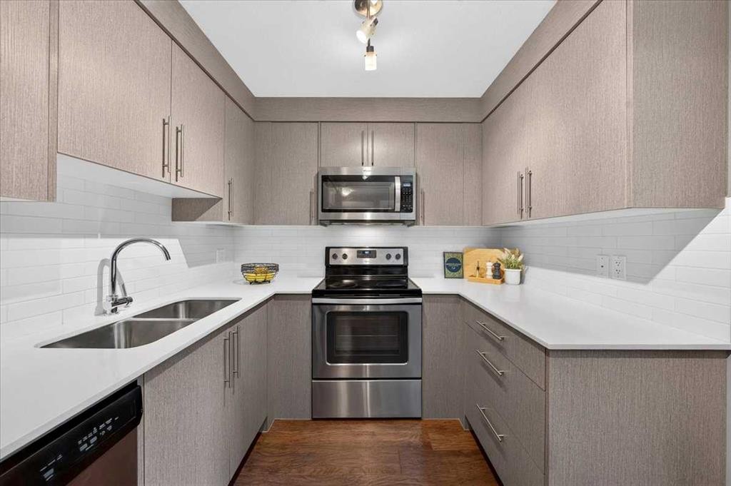 4203-302 Skyview Ranch Drive Ne, Calgary, AB - Indoor Photo Showing Kitchen With Stainless Steel Kitchen With Double Sink With Upgraded Kitchen