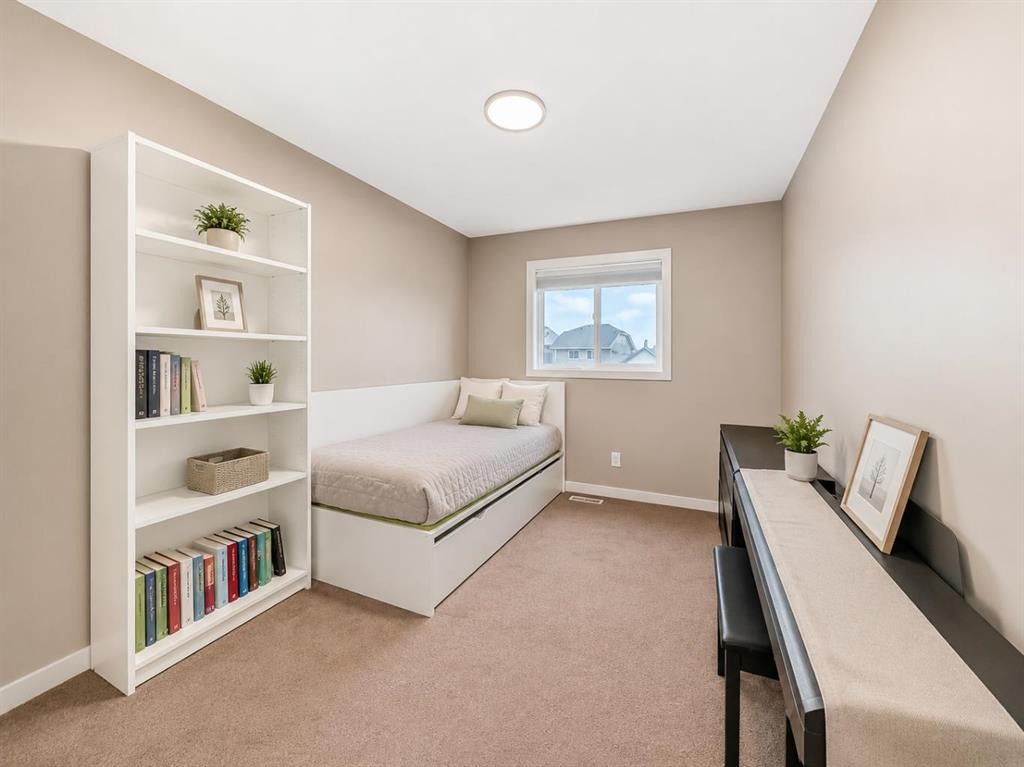 109 New Brighton Park Se, Calgary, AB - Indoor Photo Showing Bedroom