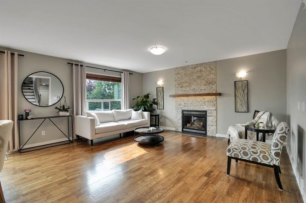 418 Long Beach Landing, Chestermere, AB - Indoor Photo Showing Living Room With Fireplace